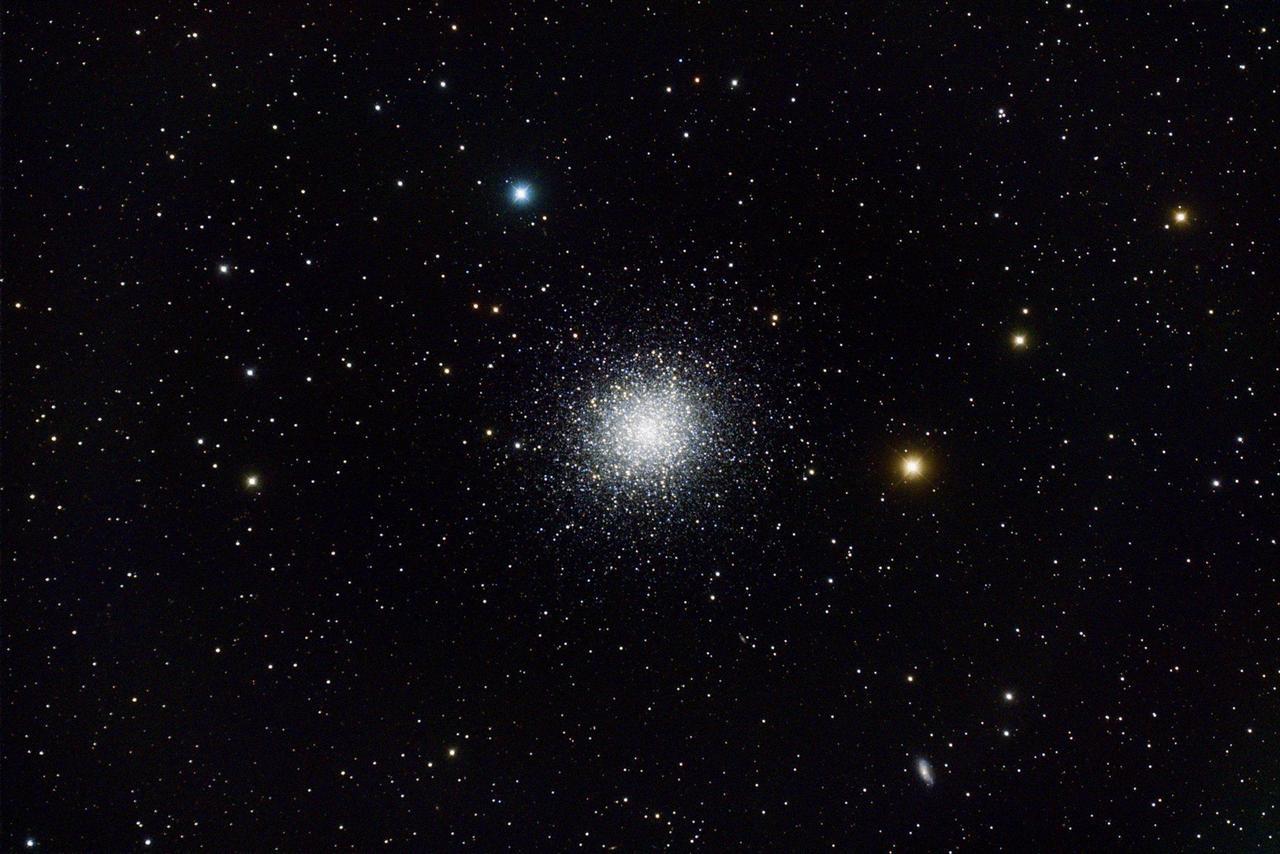 The Hercules globular cluster appears as bright cluster of several hundred thousand stars.