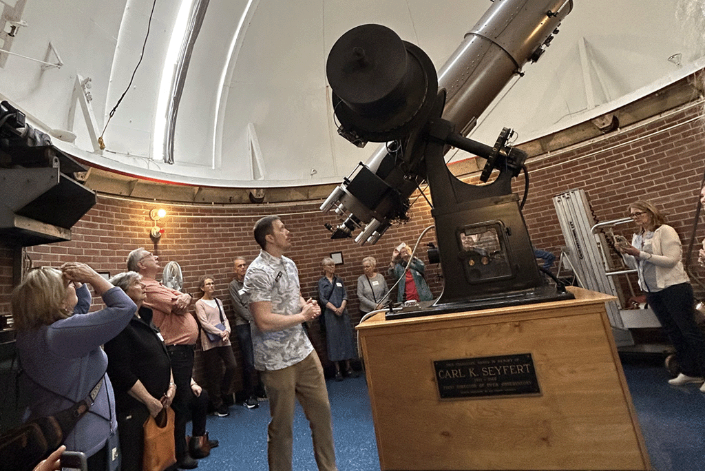 OLLI students tour Dyer Observatory as Dr. Billy Teets explains the Seyfert Telescope inside the observatory dome.