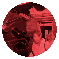 woman looking through the Seyfert telescope at Dyer Observatory