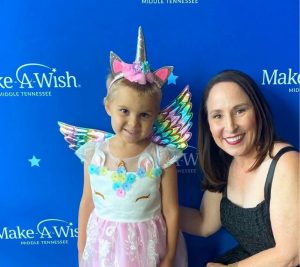 Pictured: Beth Torres poses with Make-A-Wish recipient