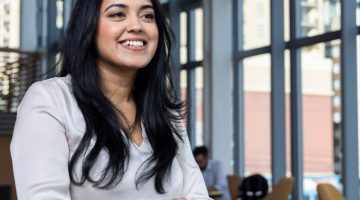 Pictured: Full-time MBA student sits in common area at Vanderbilt Business