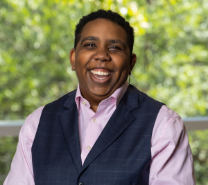 Pictured: Jen Riley is laughing in her Vanderbilt Business headshot.