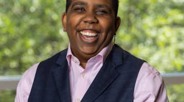 Pictured: Jen Riley is laughing in her Vanderbilt Business headshot.