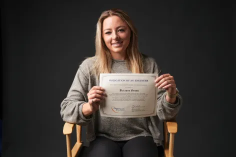 Bri Gross proudly shows her certificate for the Order of the Engineer, pledging "to practice integrity and fair dealing, tolerance and respect..." (Vanderbilt University)