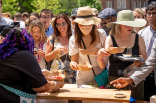 Students and their families celebrate on Alumni Lawn with Strawberries and Champagne following the Class of 2022 Commencement at Vanderbilt Stadium.