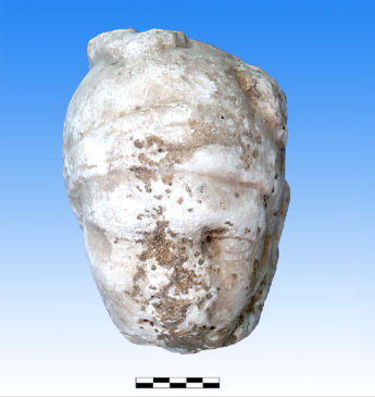 Roman-era carved marble head of an Amazon or warrior, possibly broken off from a tomb