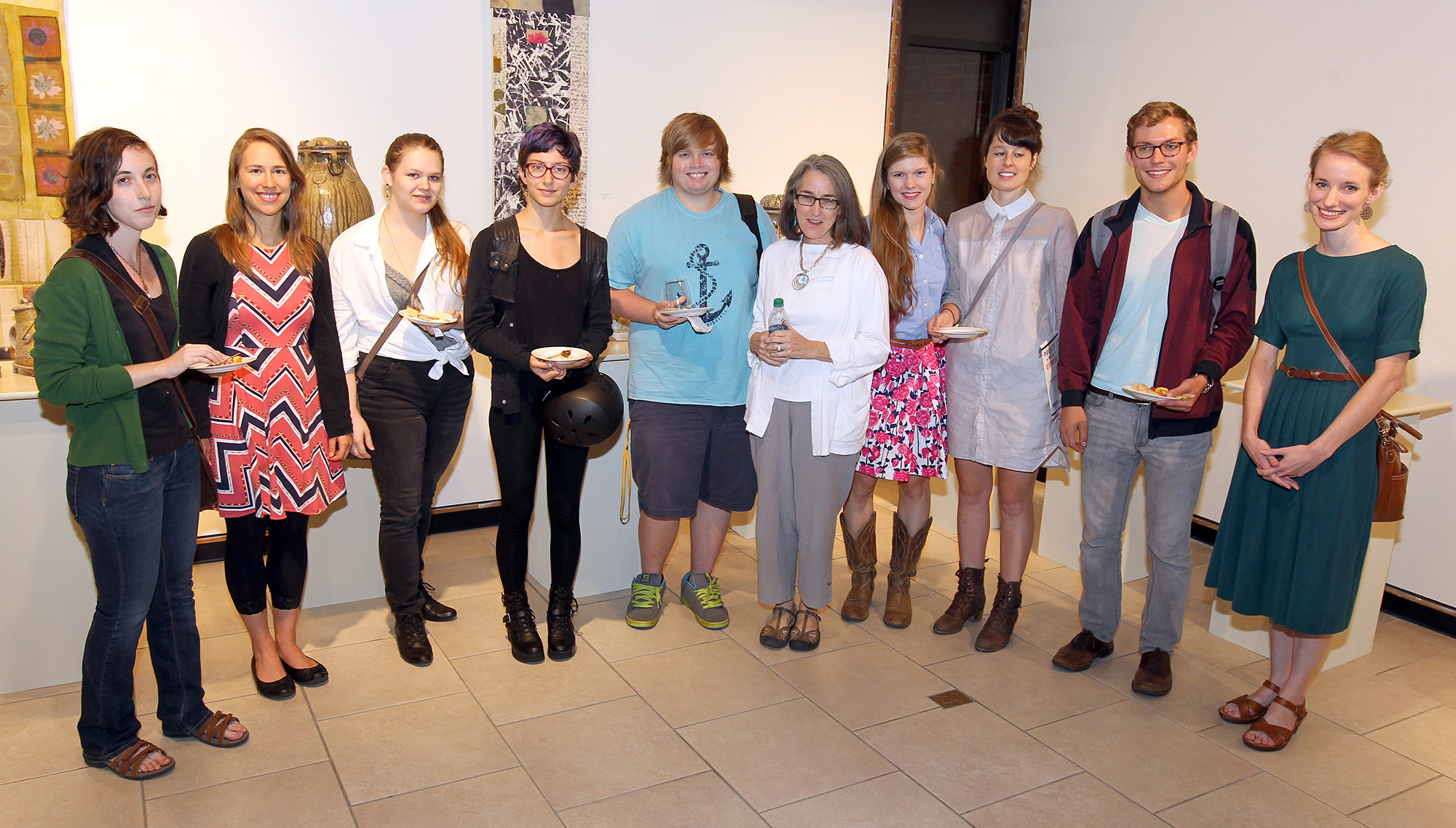 Group of people standing in an art gallery