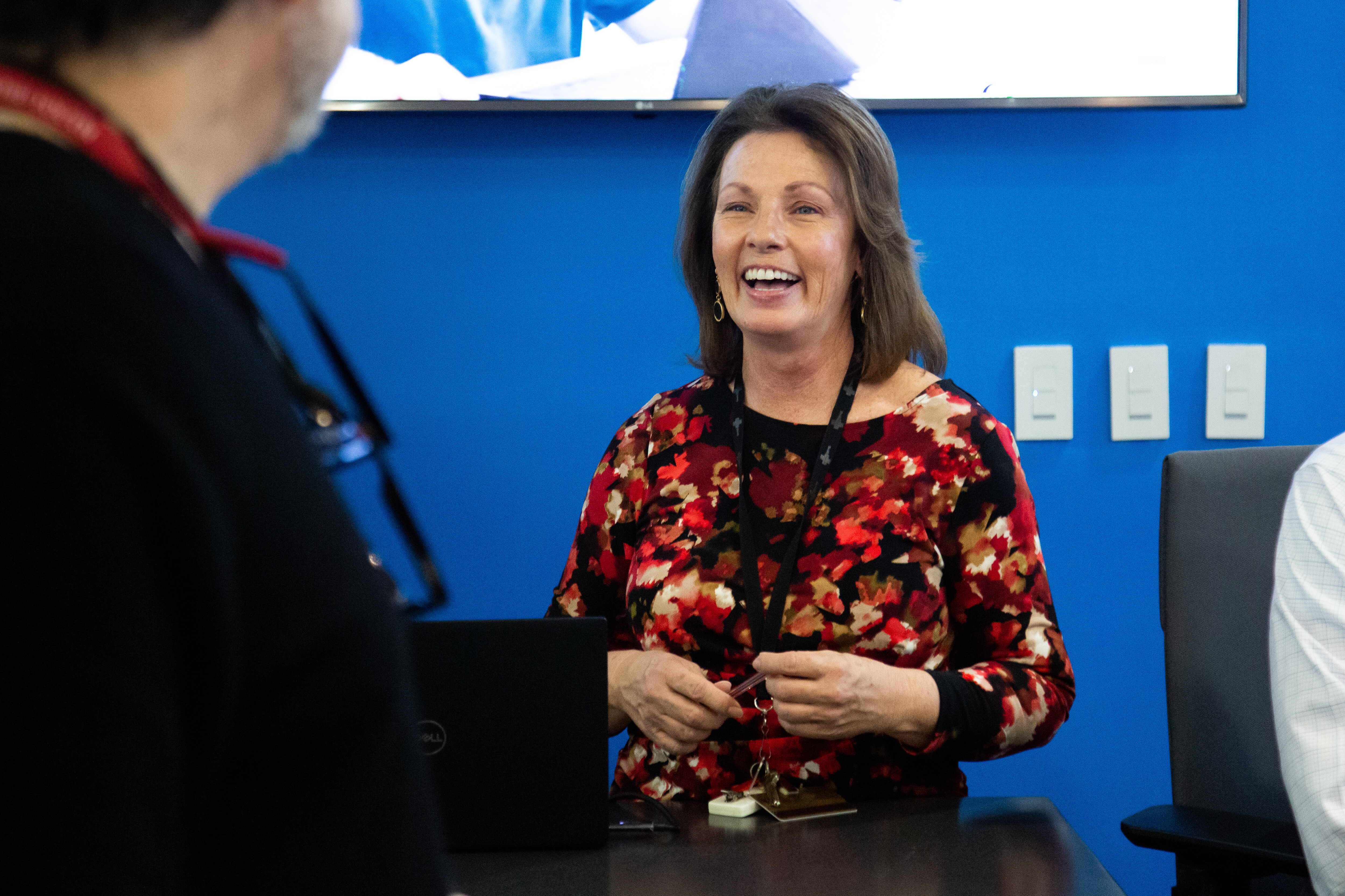 Program Manager Colette Rybinski engages with a visitor.