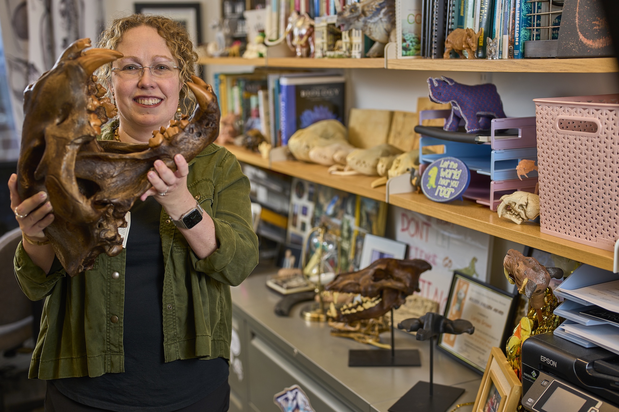 Larisa DeSantis holding a dinosaur skull. 