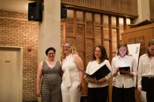 Tatum Earp joins the students who performed the sacred muisc she composed. (Submitted photo)