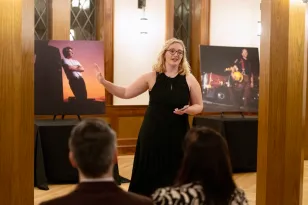 Tatum Earp explaining the music she composed based on her late father's photos (Joe Howell)