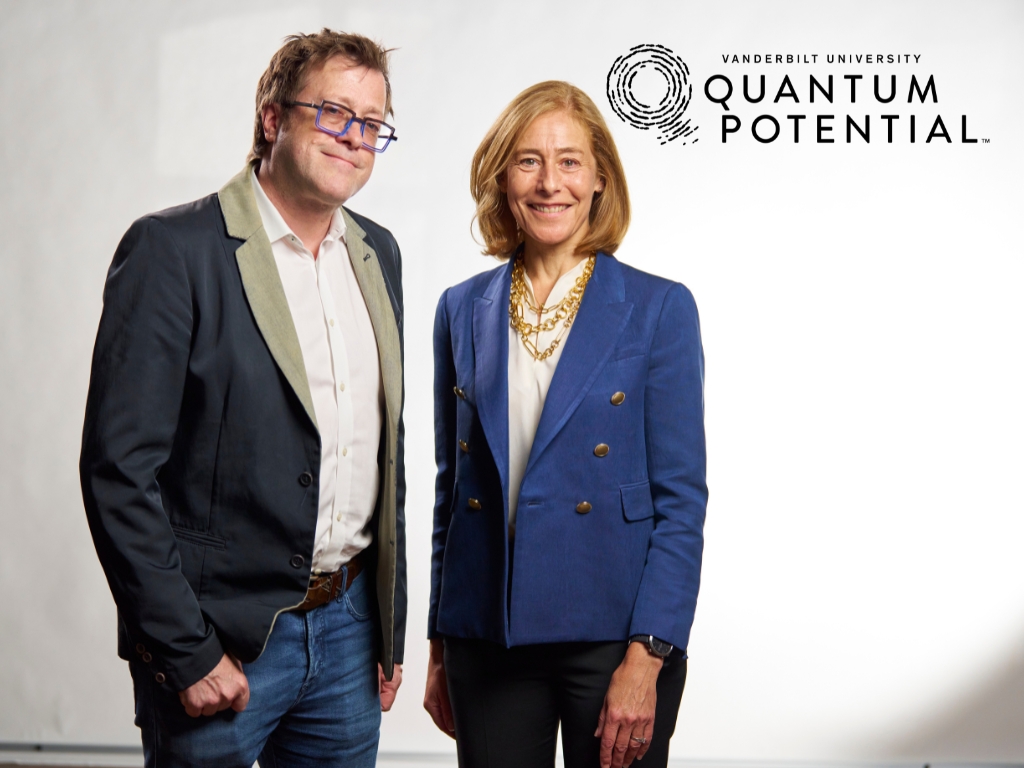 C. Cybele Raver stands with Brian Bachmann during filming of an episode of the podcast 'Quantum Potential.'