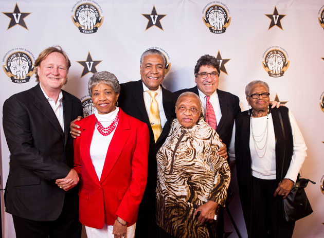 Filmmaker Rich Gentile, Perry Wallace's teammate and fellow SEC pioneer Godfrey Dillard and Chancellor Nicholas S. Zeppos with Wallace's sisters at the premiere of "Triumph: The Untold Story of Perry Wallace" on Dec. 4. (Susan Urmy/Vanderbilt)