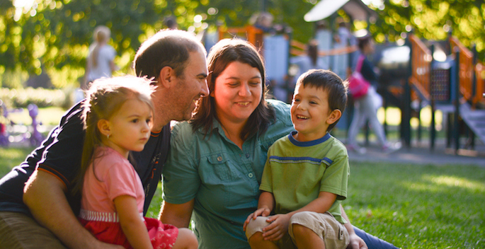family enjoying suny day outside