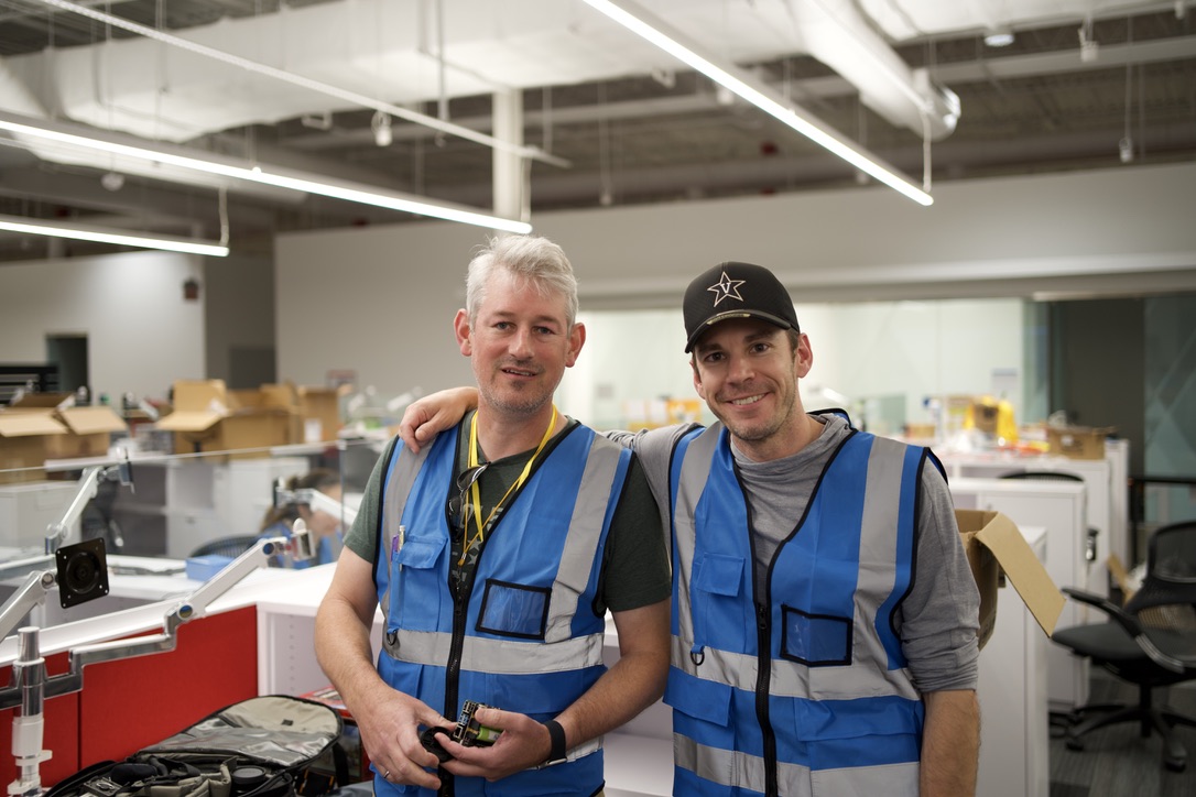 Engineering duo Dan Work and Jonathan Sprinkle standing in a lab