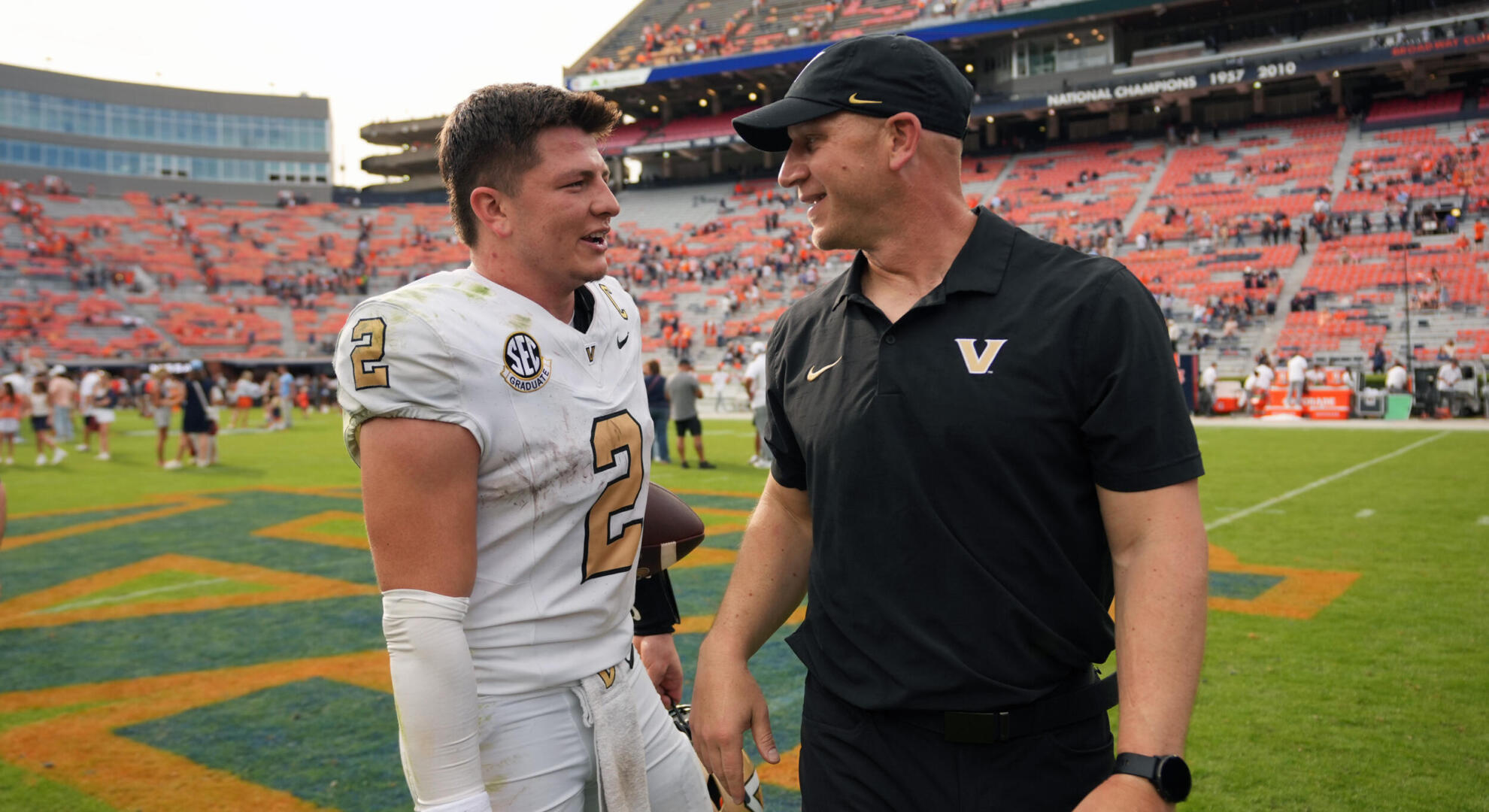 Head coach Clark Lea and quarterback Diego Pavia talk on field during the Auburn game. 