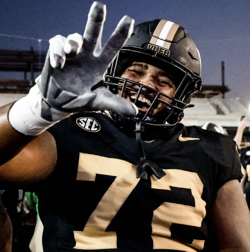 Josh Raymond gives the Vanderbilt hand sign to the camera to celebrate the football team win over Alabama.