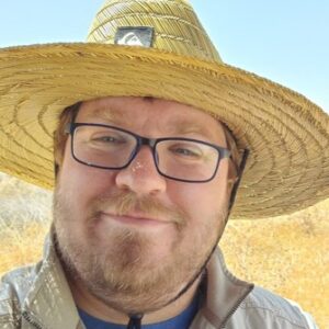 Man in straw hat smiling