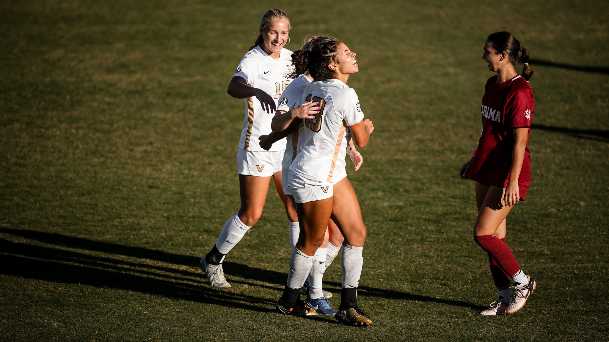 Soccer players celebrating their win over Alabama.