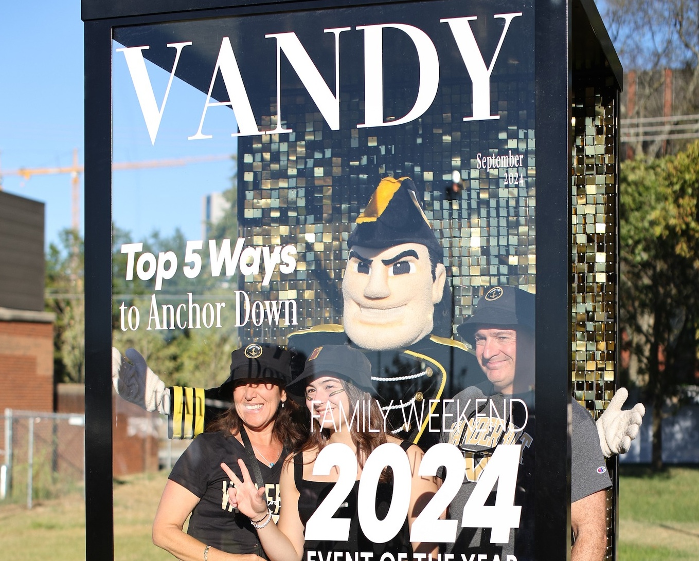 A family poses with Mr. C during Family Weekend 2024