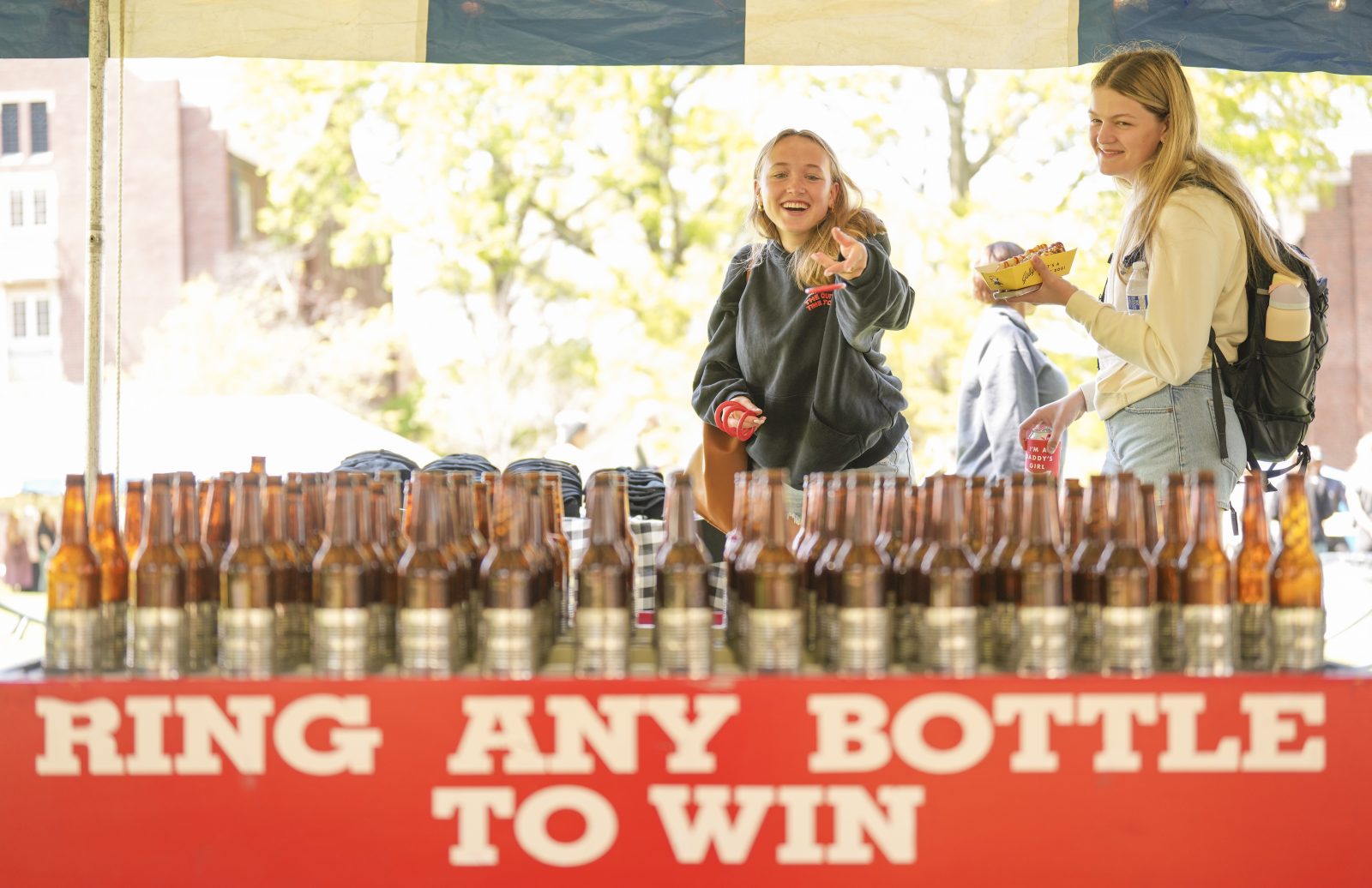 Students play a carnival game on Giving Day.