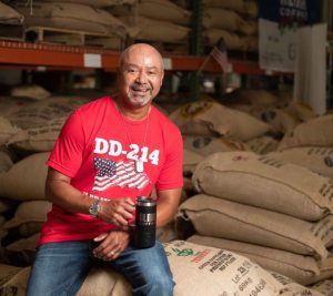Pictured: Vanderbilt Executive MBA alum Al Lopez in his coffee warehouse