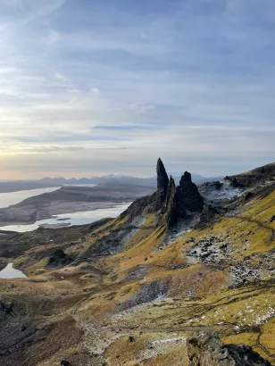 Katie Bishop in Scotland "During my time abroad, some fellow exchange students and I went on many hikes in the Scottish Highlands! I took this photo after an early morning hike up the 'Old Man of Storr,' a famous location on the Isle of Skye and a Scottish legend. The tall peaks in the photo are said to be the fingers of an ancient giant covered in earth. Learning about the Gaelic and Norse legends that have enriched Scotland's culture through my IFSA program and study abroad classes were some of my favorite aspects of my study abroad experience!"
