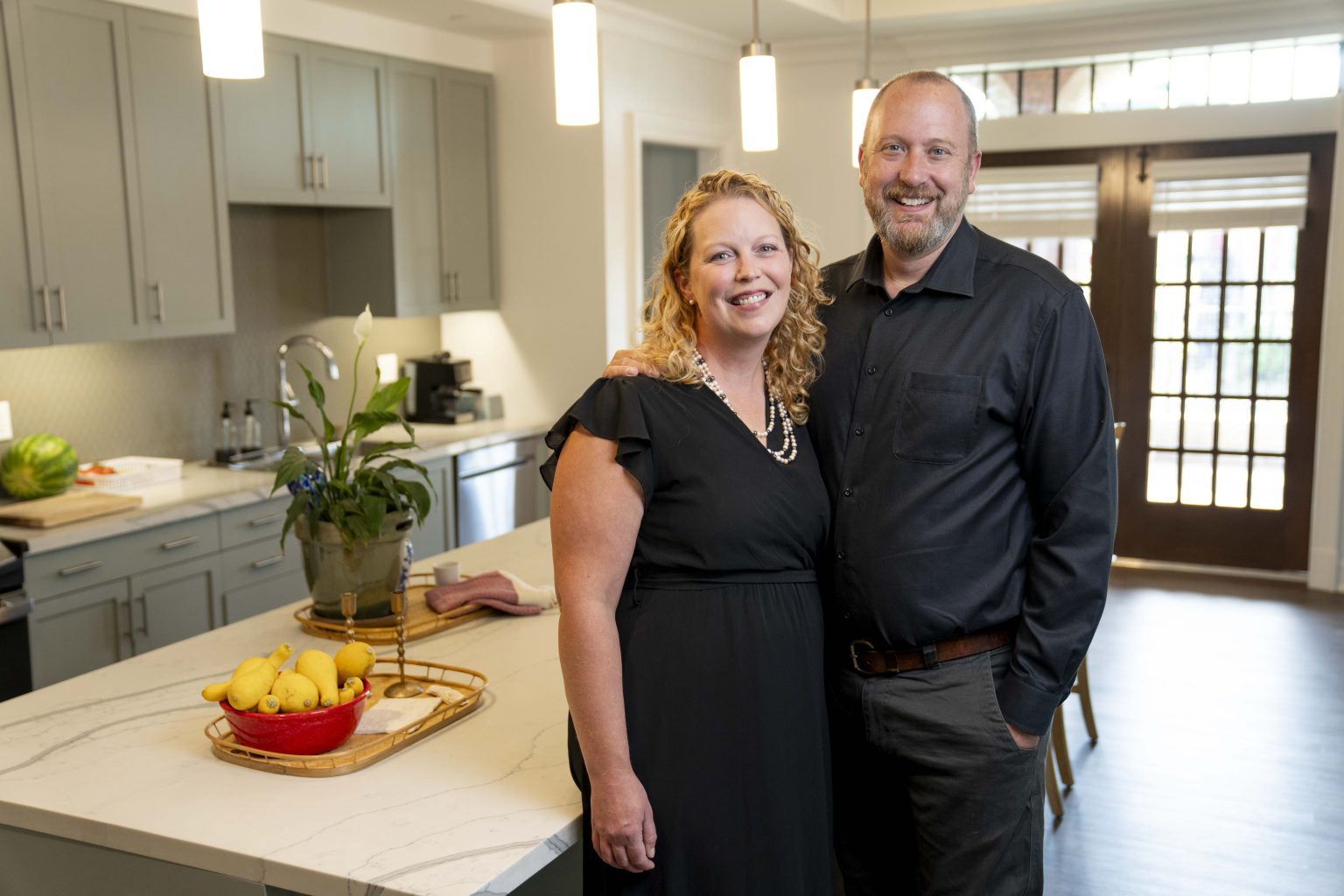Emily Pendergrass with her husband Josh at their new home, Carmichael College.