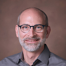 Man in glasses smiling