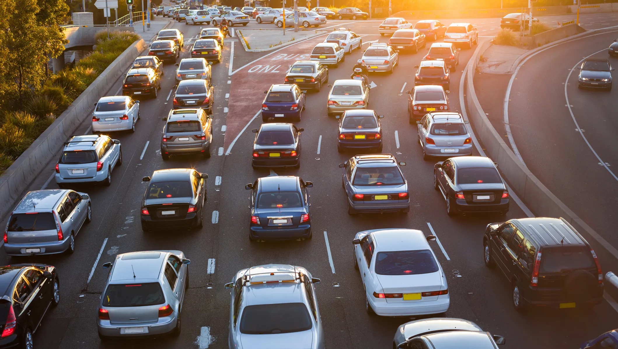 Aerial image of cars commuting around a city. 