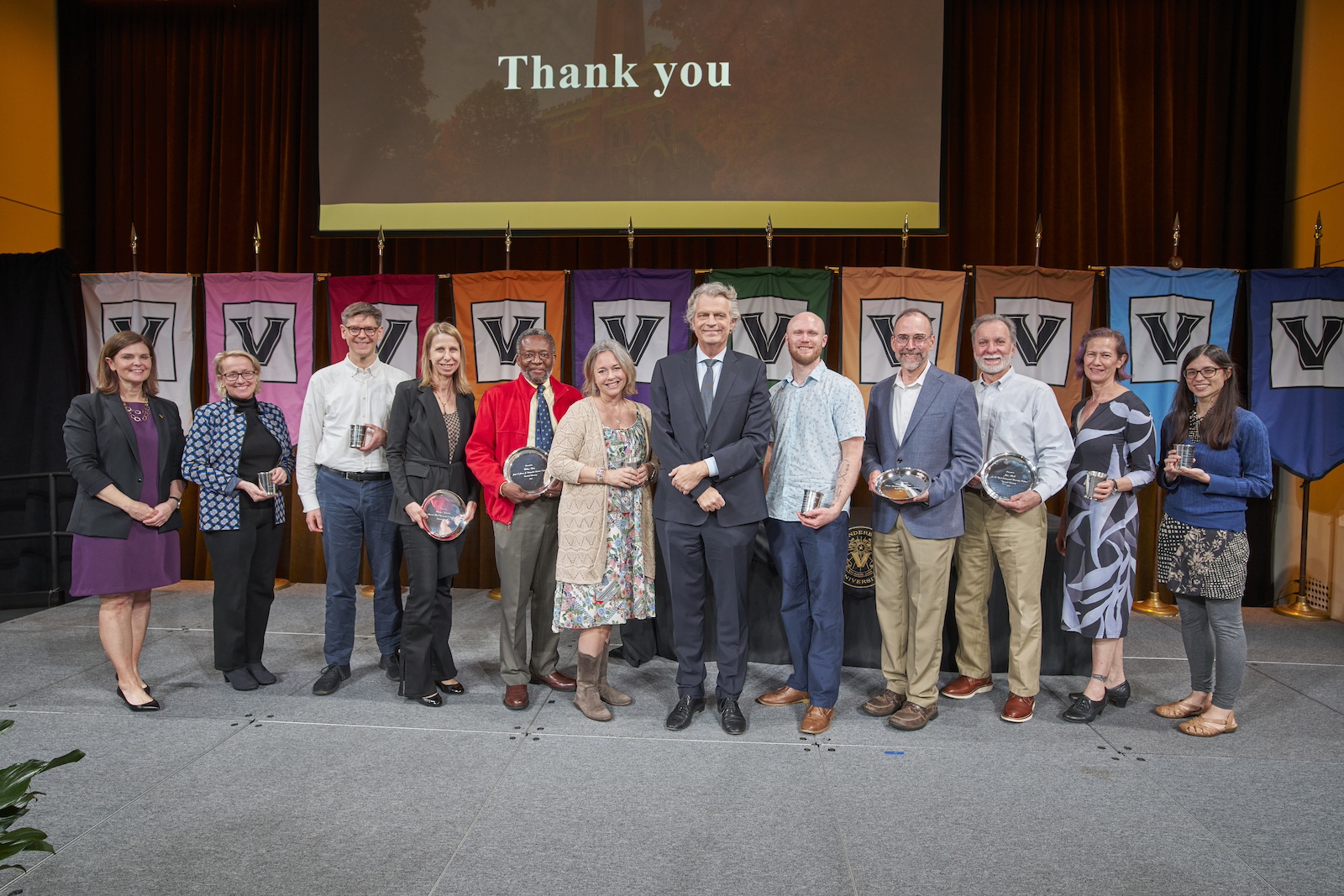 Faculty awardees pose with Chancellor Daniel Diermeier at the 2024 Spring Faculty Assembly.