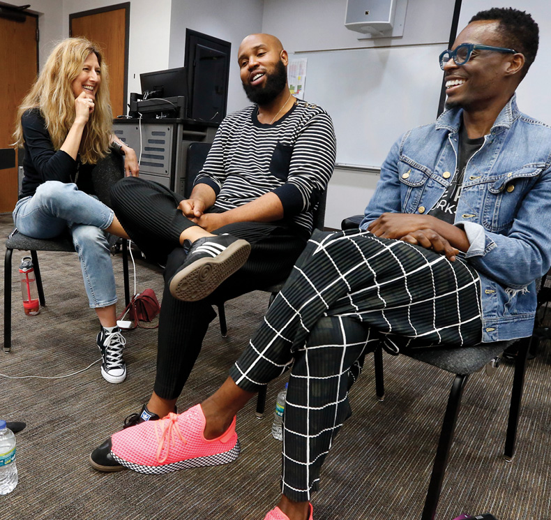 Blair’s Deanna Walker, left, welcomes to her songwriting class Claude Kelly, middle, and Chuck Harmony of the duo Louis York. Photo by Steve Green