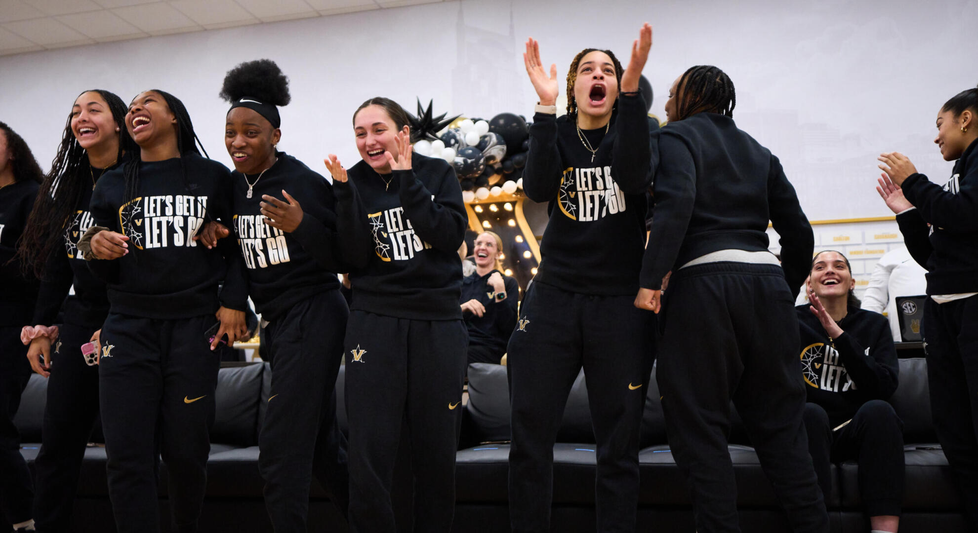 Members of the women's basketball team celebrate their Selection Sunday tournament announcement. 