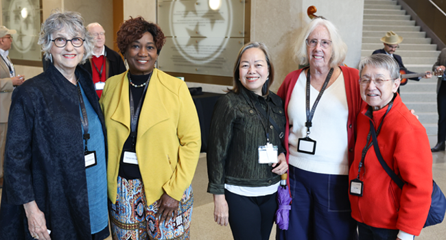 Group of smiling adult students at Osher Lifelong Learning Institute