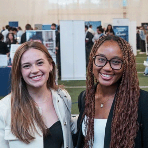 two female Vanderbilt student-athletes dressed in business attire