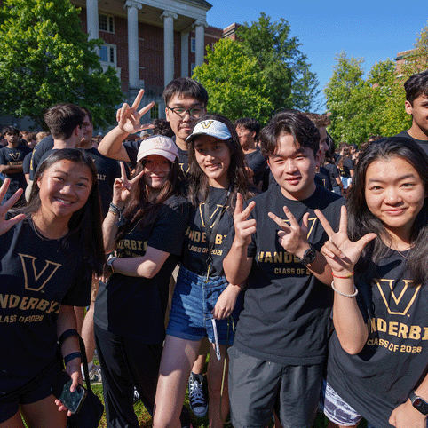 Vanderbilt students pose for a group photo wearing Vanderbilt t-shirts