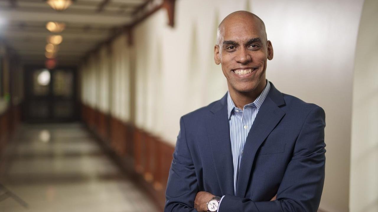 Matthew Johnson Roberson stands in a hallway