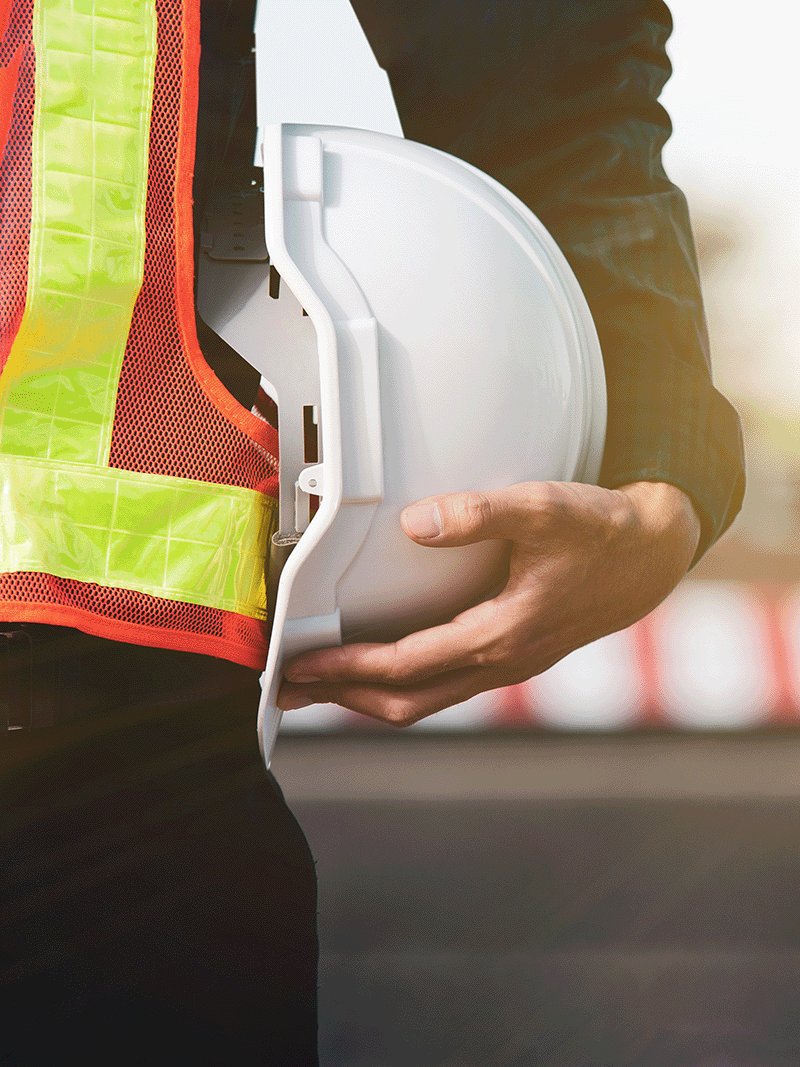 construction worker holding a hard hat