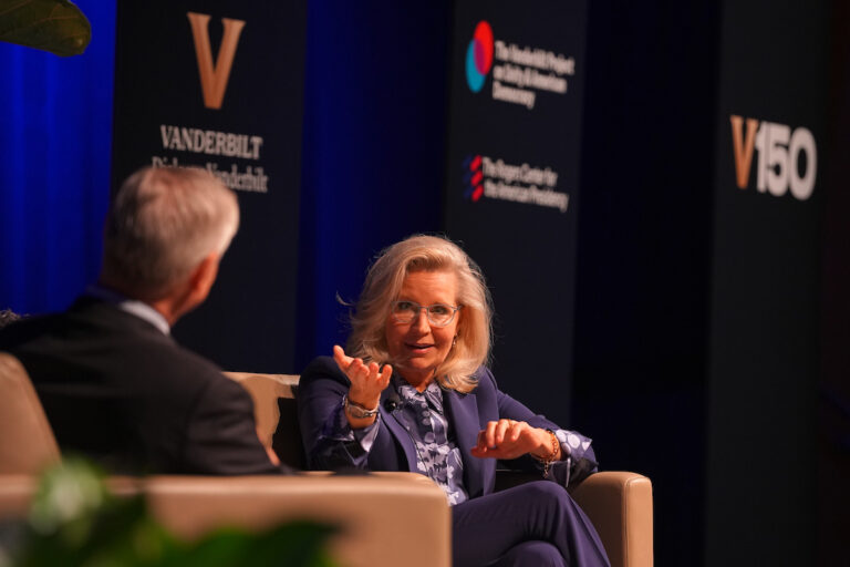 Former U.S. Rep. Liz Cheney and Jon Meacham, Carolyn T. and Robert M. Rogers Chair and distinguished visiting professor of political science, speak during a discussion at the inaugural event.