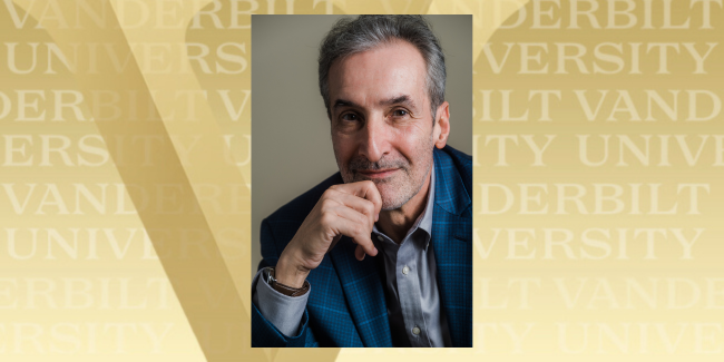 A headshot of Sam Freedman sits atop a standard gold V Vanderbilt University background.