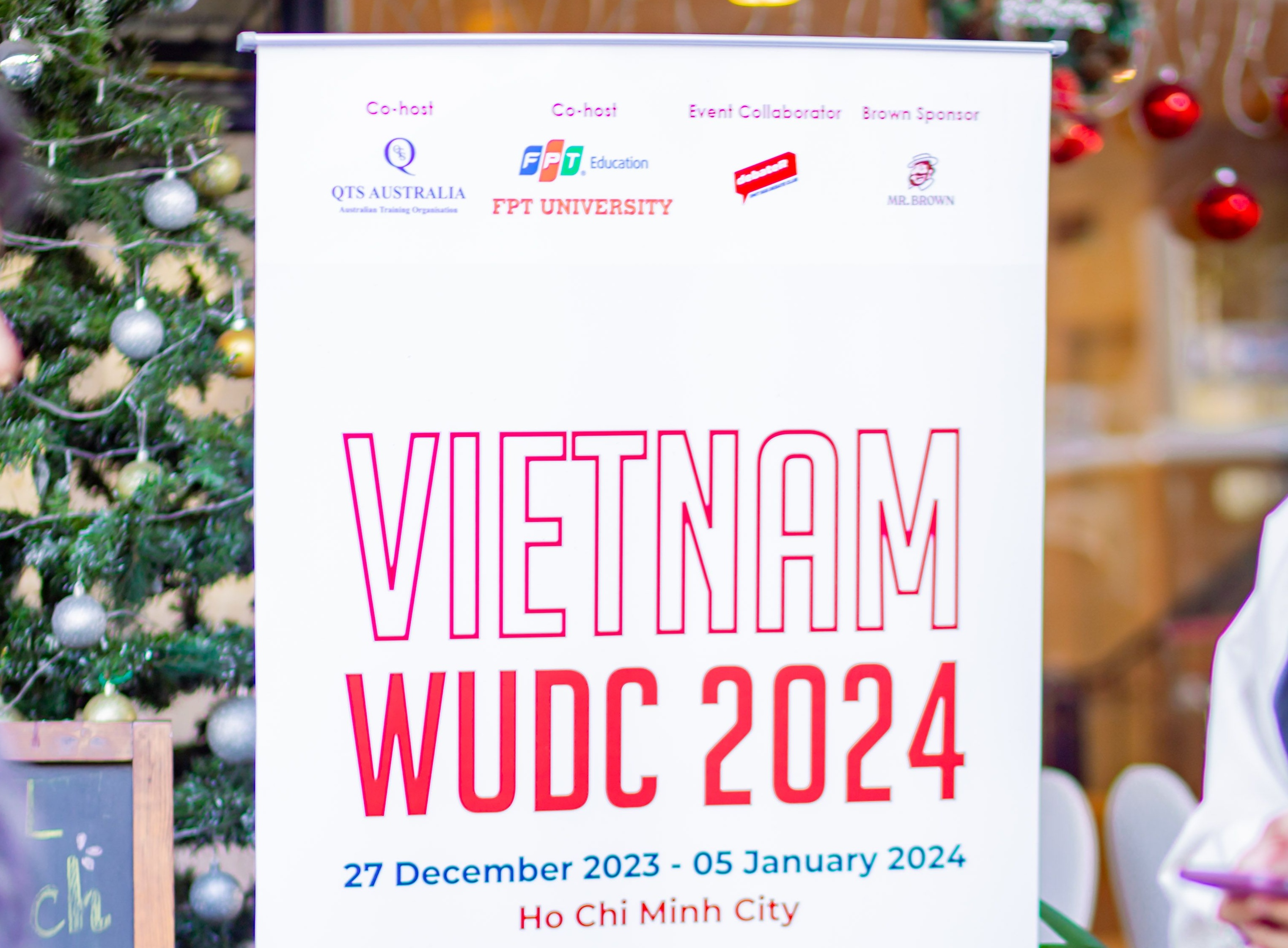 Event poster for the Vietnam World Universities Debating Championship 2024.