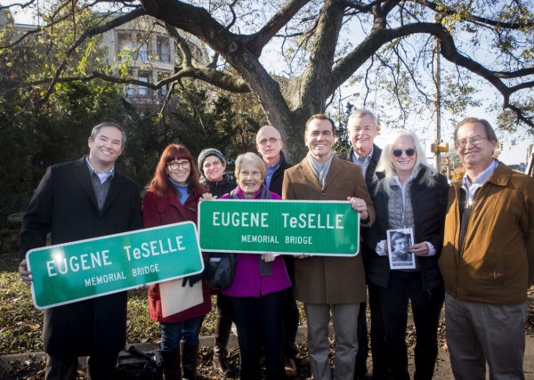 Family and friends of the late Gene Teselle attend dedication ceremony for naming of bridge over I-440 in memory of Teselle.
