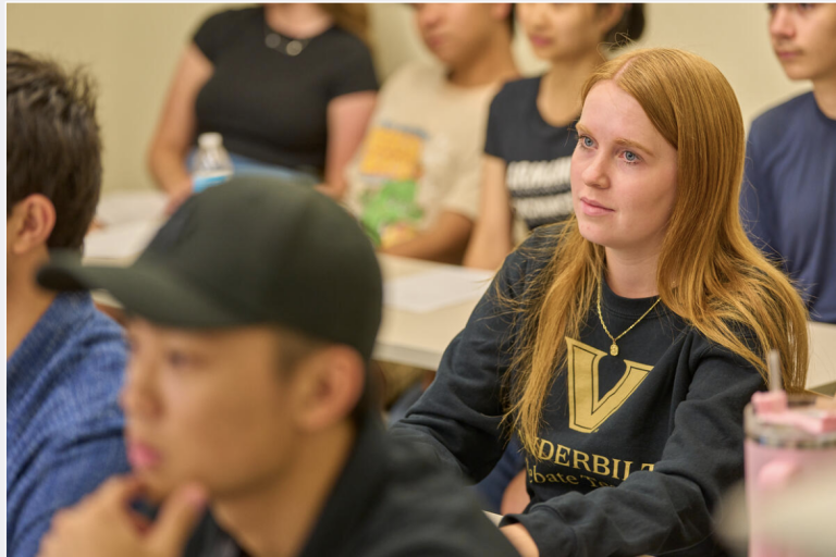 Debate students listen during practice. 
