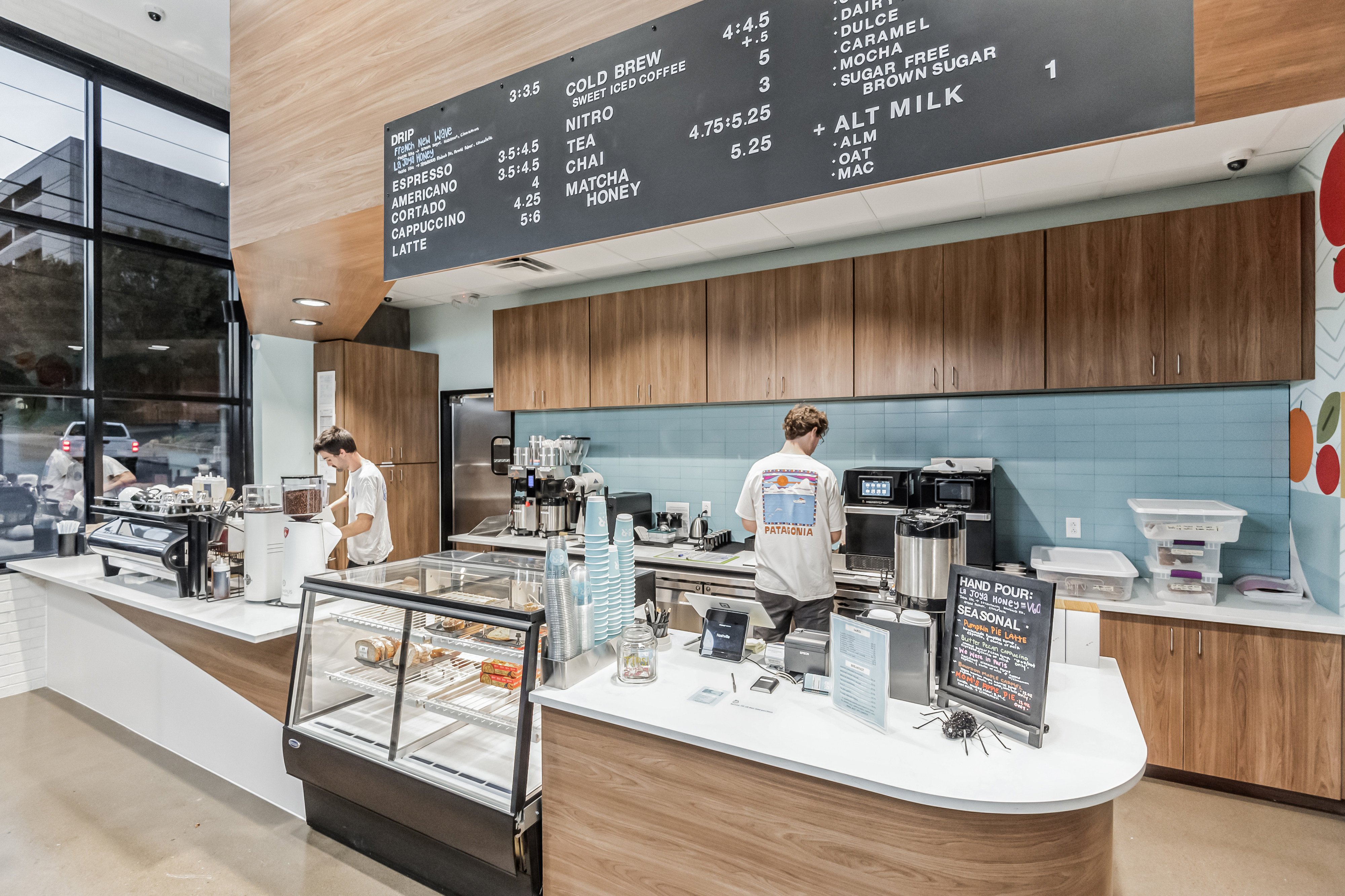 Employees make coffee at 8th & Roast