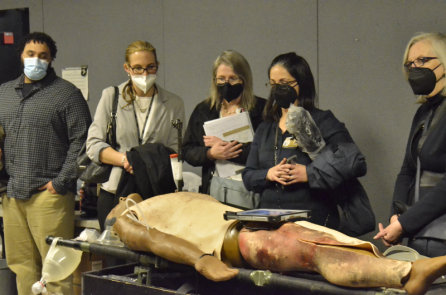 Leaders from Vanderbilt University School of Nursing tour the Alfred V. Rascon School of Combat Medicine Feb. 24, taking a closer look at the realistic dummies used to simulate combat-related injuries during training exercises. (Ethan Steinquest/Fort Campbell Courier)