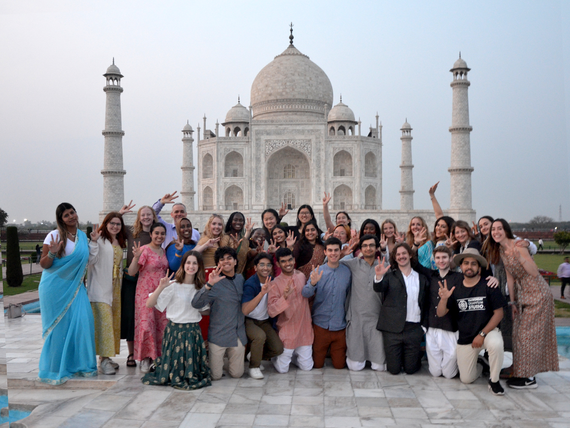 Students display the Vanderbilt hand sign in front of the Taj Mahal