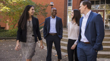 Masters in Finance students walking on campus.