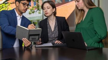 Pictured: Vanderbilt MS Finance students from the class of 2025 look at notes