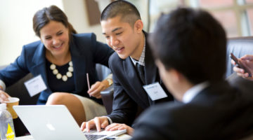 Accelerator students work together to solve business challenges