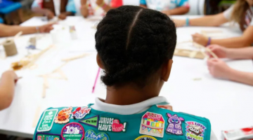 Pictured: In this July 21, 2017 photo, badges are seen on the vest of a member of the Girl Scouts of Central Maryland as Girl Scouts participate in an activity introducing them to the world of robotics in Owings Mills, Maryland. Patrick Semansky/AP/File